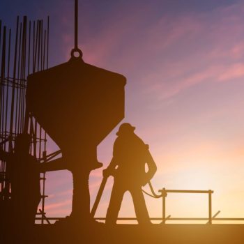 Commercial concreting being done by Complete Concreters Mornington workers during sunset